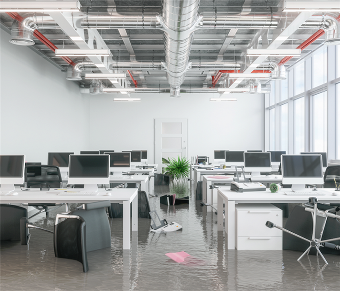 a flooded office with water covering the ground
